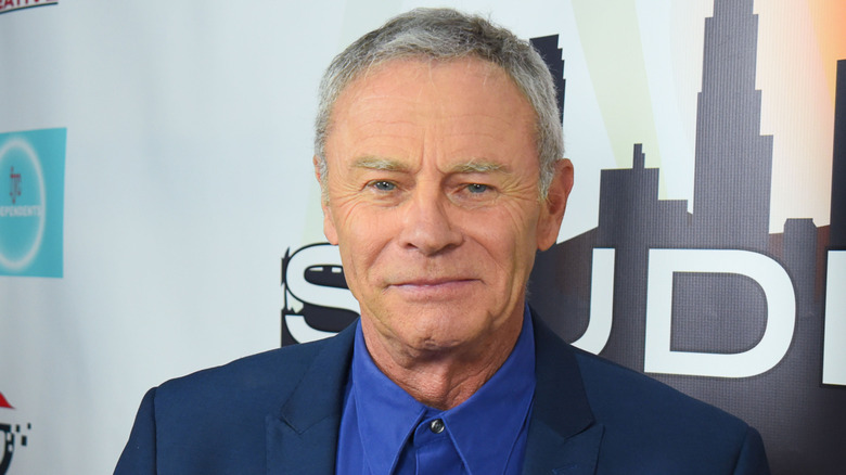 Tristan Rogers posing in blue at an event