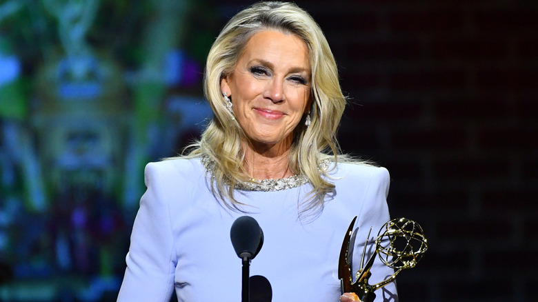 Deborah Norville smiling and holding Emmy