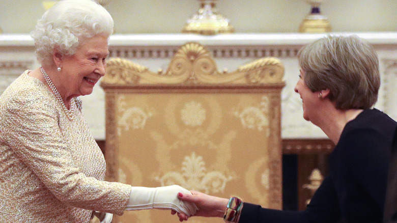 Queen Elizabeth and former prime minister Theresa May
