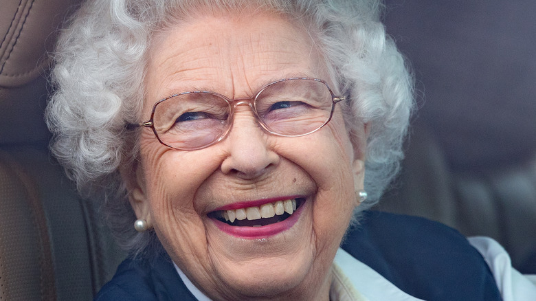 Queen Elizabeth smiles while driving 2021
