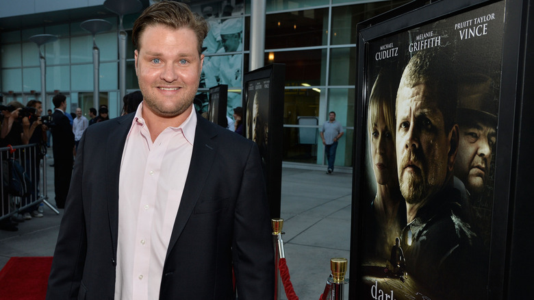 Zachery Ty Bryan smiling for photo at movie event