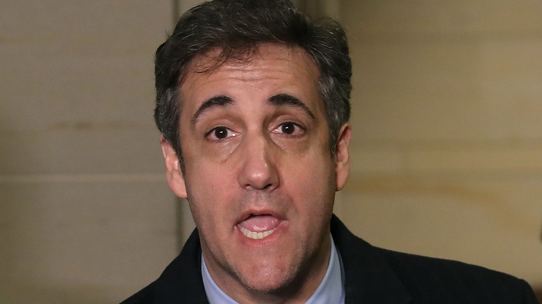 Michael Cohen speaking wearing a dark jacket