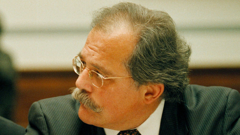 Ty Cobb seated in a courtroom