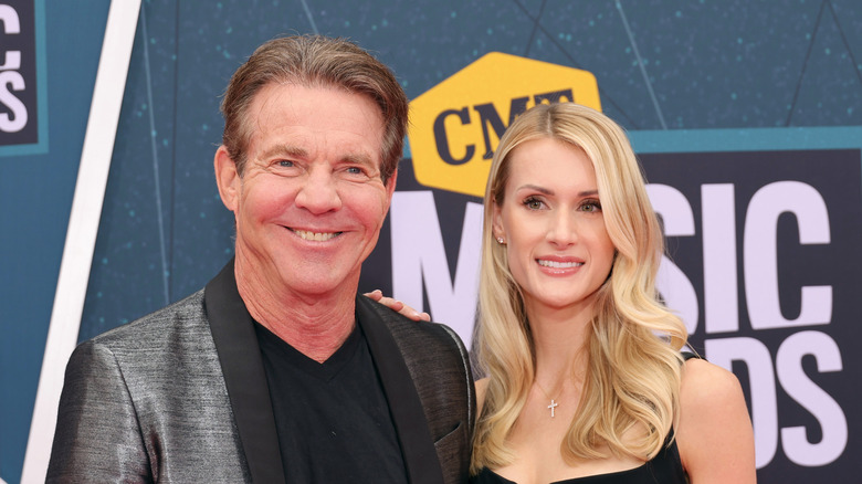 Dennis Quaid and Laura Savoie posing together at the 2022 CMT Music Awards