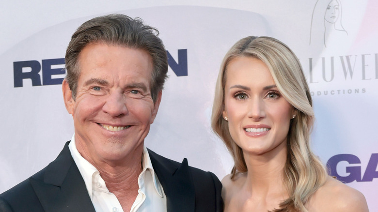 Dennis Quaid and Laura Savoie smiling together at an event in 2024