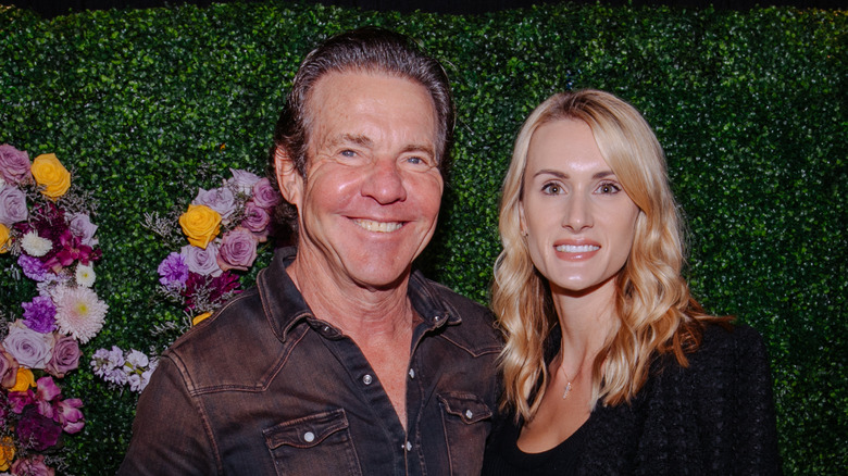 Dennis Quaid and Laura Savoie posing together in 2022