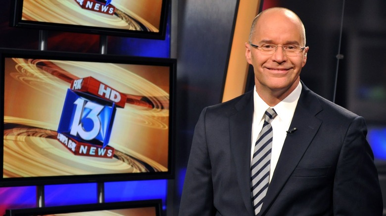 Russell Rhodes smiling on Fox 13 set