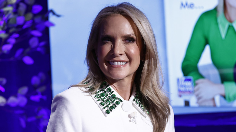 Dana Perino smiling hesitantly