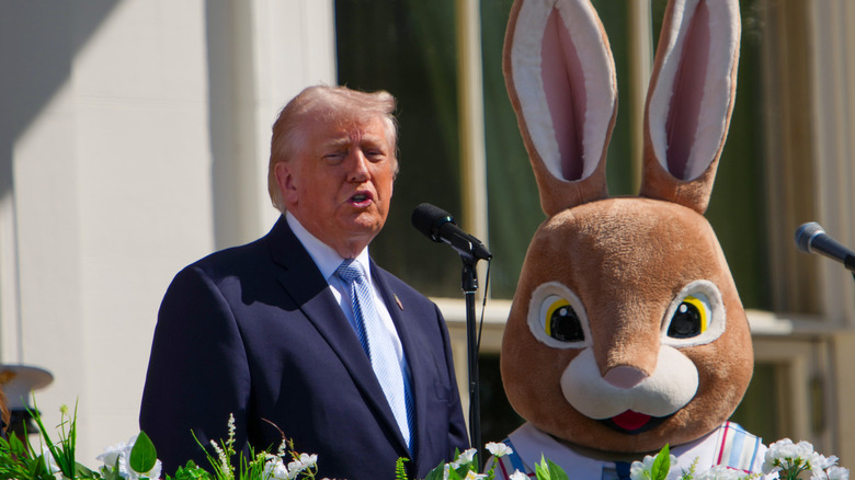 U.S. President Donald Trump speaks next to the Easter Bunny on the balcony of the White House during the Easter Egg Roll on April 06, 2026 in Washington, DC.