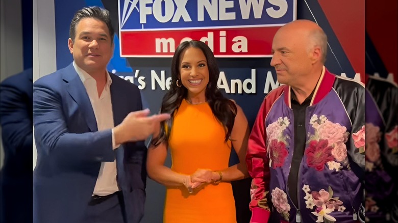 Dean Cain and Kevin O'Leary posing with Emily Compagno at Fox News studio