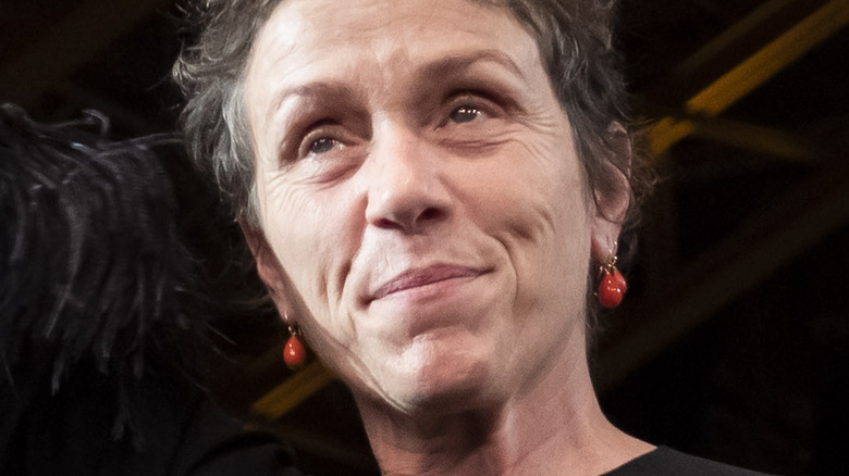 Frances McDormand raising hand