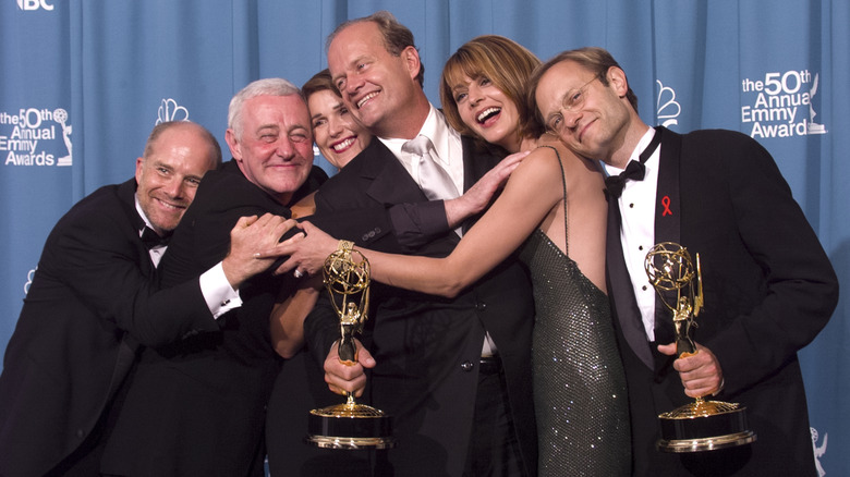 The cast of Frasier hugging with their Emmys
