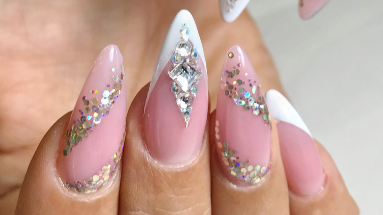 Pointed fingernails with glittering stones