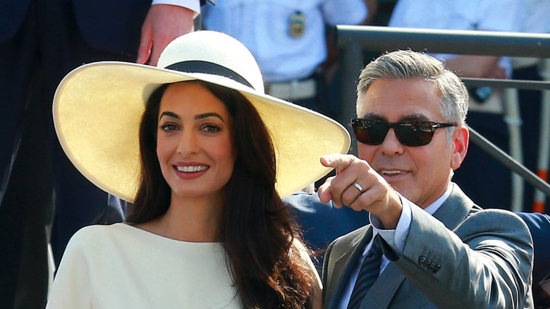 Amal and George Clooney outside