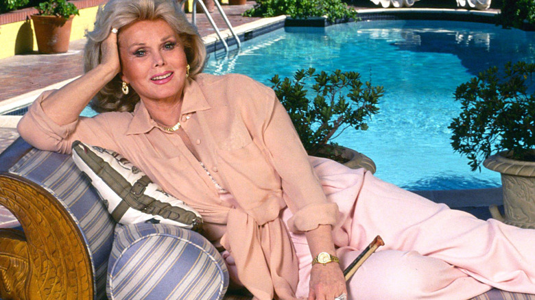 Zsa Zsa Gabor in front of a pool