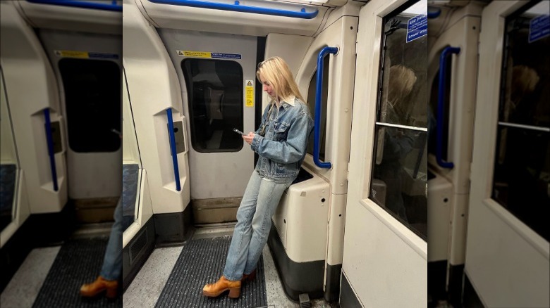 Woman wearing double denim on subway