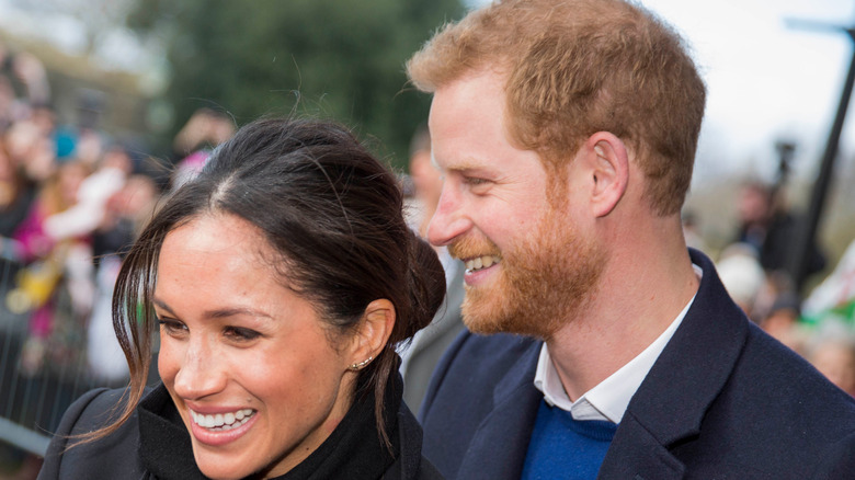 Prince Harry and Meghan Markle smiling