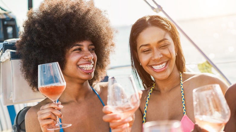 friends smiling on a boat