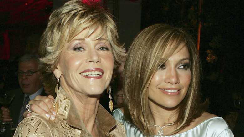 Jane Fonda smiles and poses next to her co-star Jennifer Lopez