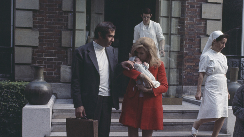 Jane Fonda cradles her newborn baby alongside husband Roger Vadim