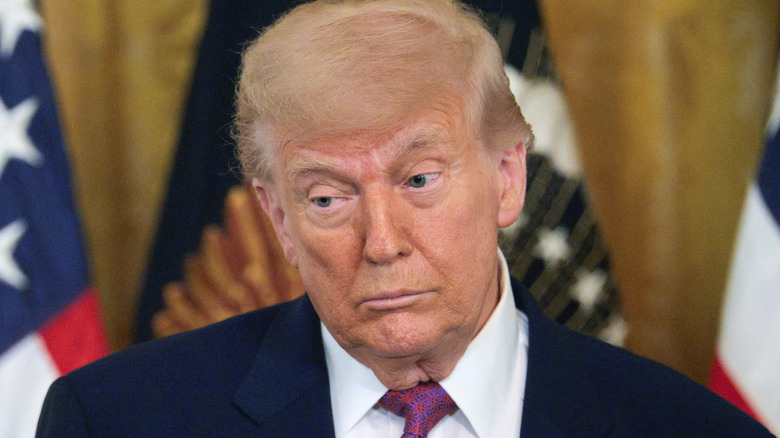 Donald Trump raising his eyebrows at someone