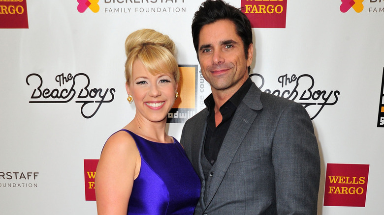 Jodie Sweetin and John Stamos posing together for a photograph
