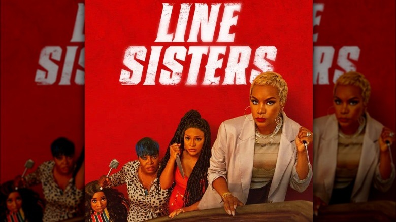 Drew Sidora and the cast of Line Sisters posing with weapons