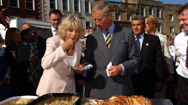 King Charles III sharing a bite with Queen Camilla