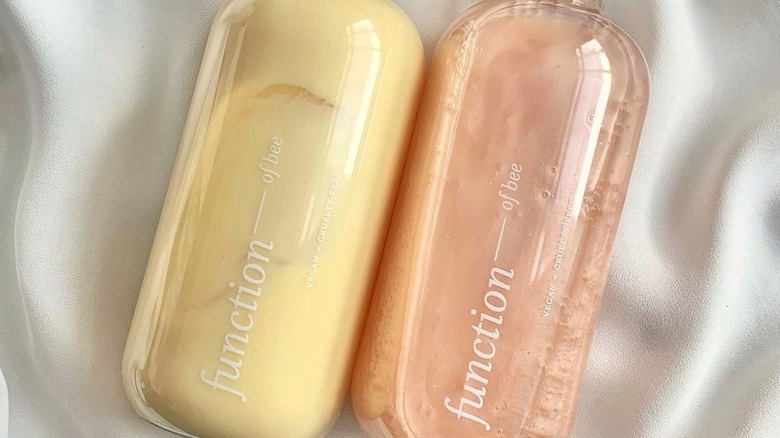 Two bottles of Function of Beauty hair care products