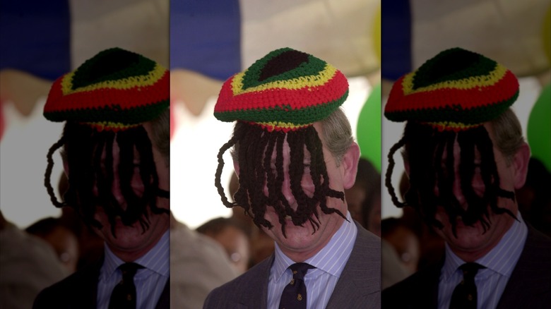 King Charles III wearing a Rasta cap backwards