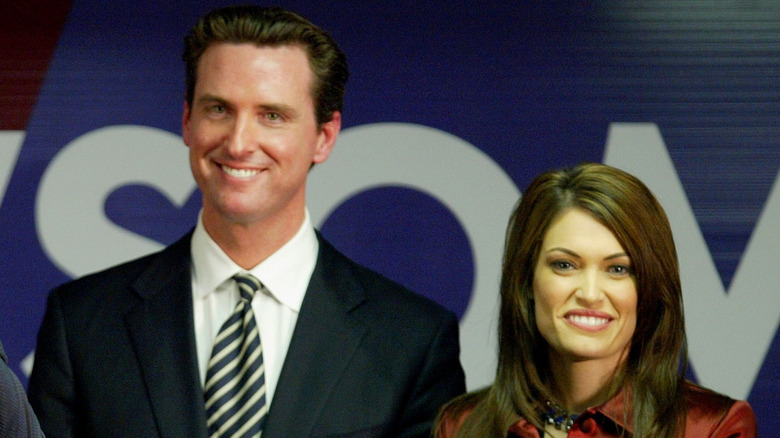 Gavin Newsom and Kimberly Guilfoyle smiling