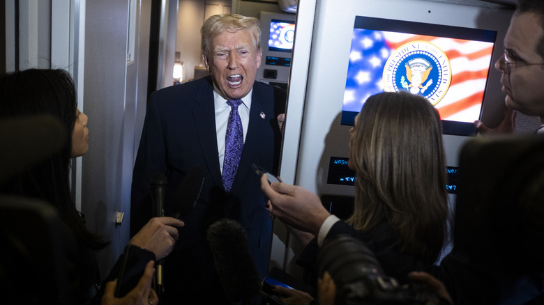 Donald Trump seemingly shouting at reporters