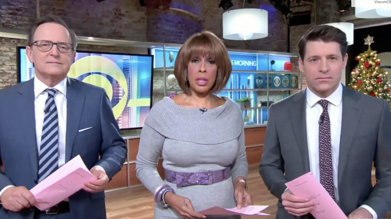 Gayle King, center, standing between Anthony Mason and Tony Dokoupil