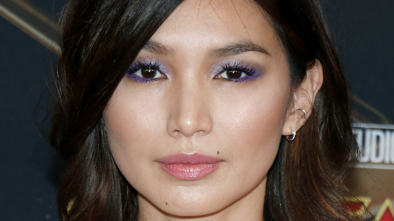 Gemma Chan posing for a picture on the red carpet