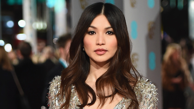 Gemma Chan with brunette hair at an event