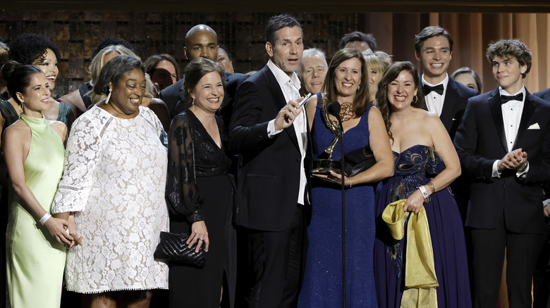 Cast and crew of General Hospital on stage smiling