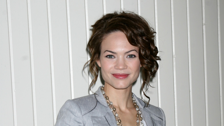 Rebecca Herbst posing at an event