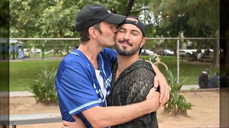 Colton Little kissing Adrian Anchando