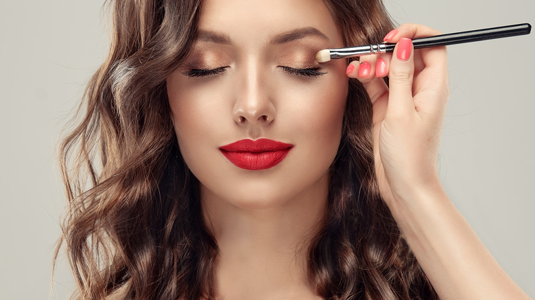 Woman getting her makeup done