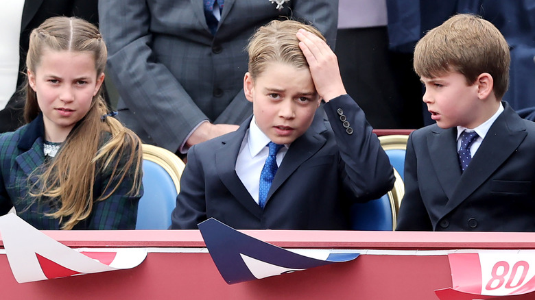 Princess Charlotte, Prince George, and Prince Louis sitting together