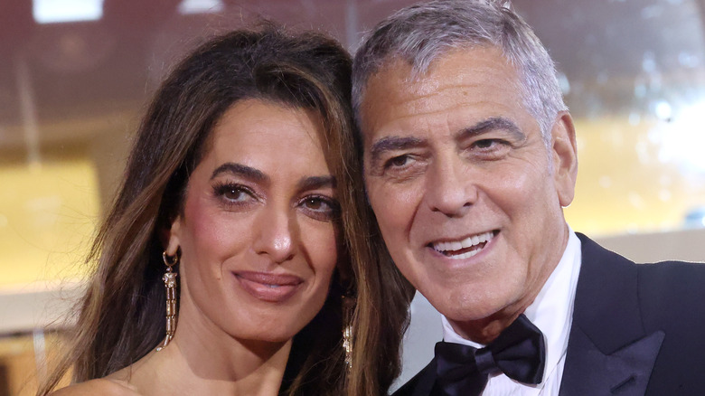 George Clooney and Amal Clooney attend the "Jay Kelly" red carpet during the 82nd Venice International Film Festival on August 28, 2025 in Venice, Italy (2025)