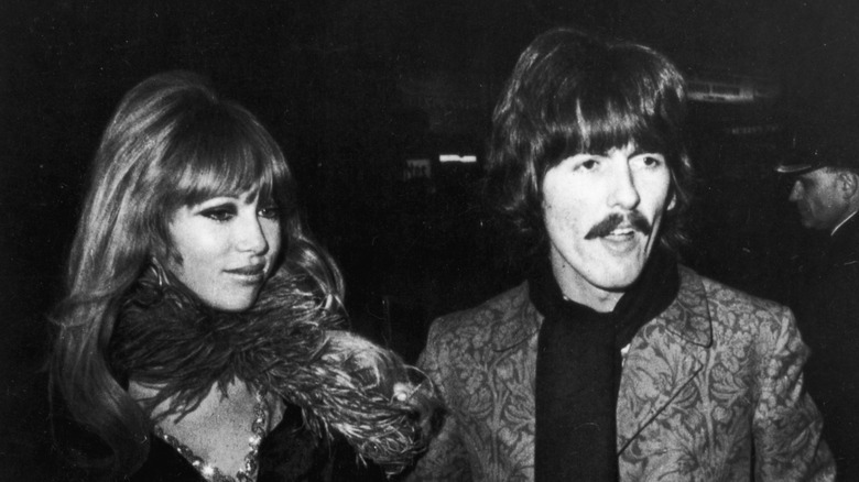 Pattie Boyd and George Harrison smiling.