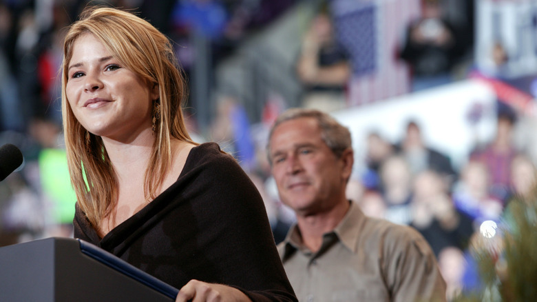 George W. Bush standing behind Jenna Bush