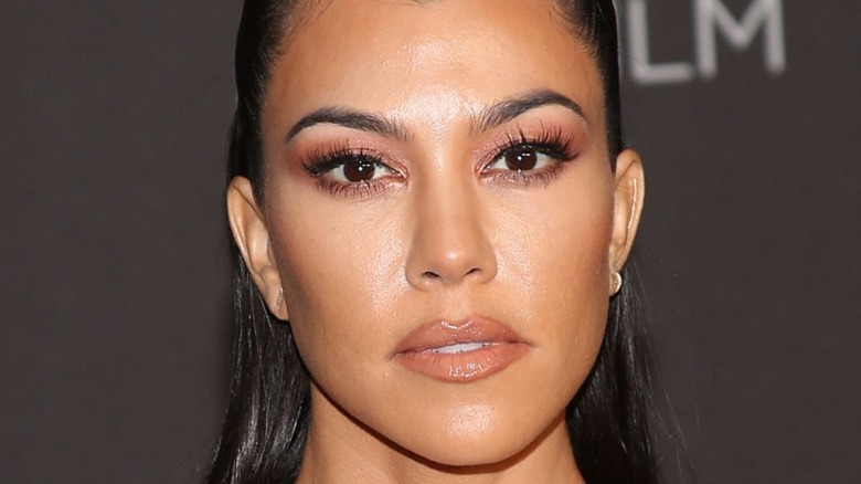Kourtney Kardashian in makeup at event