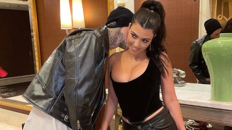 Kourtney Kardashian with Travis Barker in corset top