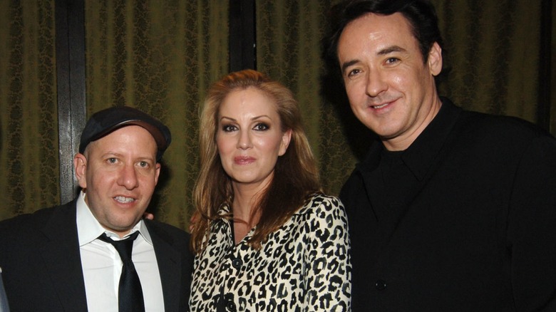 John Cusack, Mary Parent, and Steve Pink smiling at an event together.