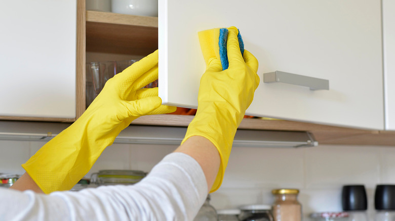 Cleaning kitchen cabinets