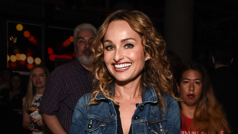 Giada de Laurentiis smiling in jean jacket