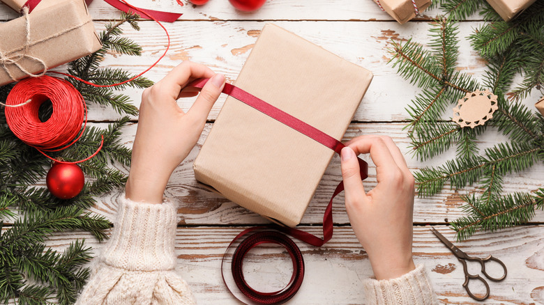 hand wrapping holiday presents