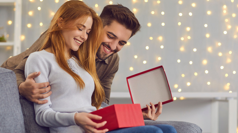 woman opening gift